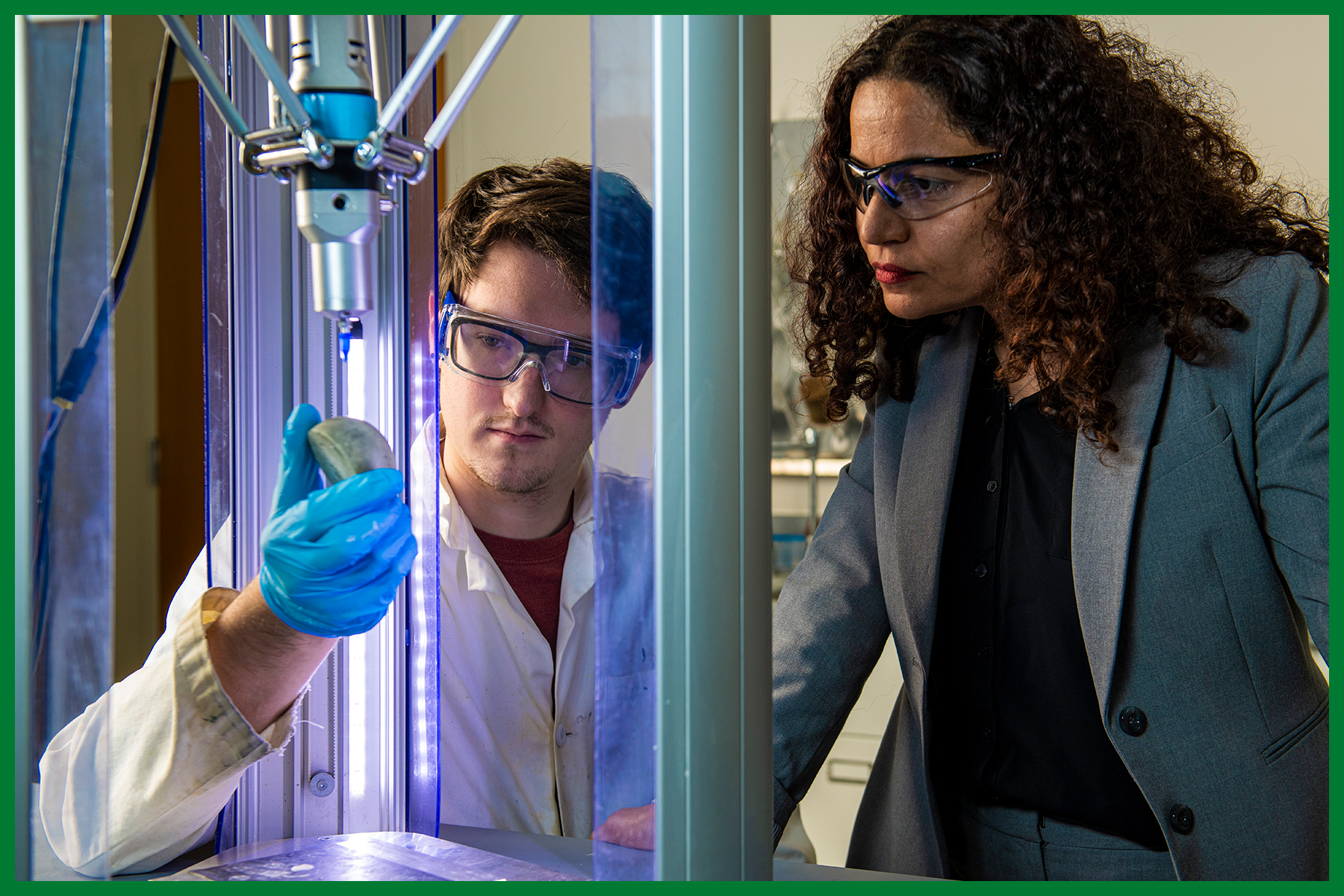 Student and faculty working together in chemical engineering lab